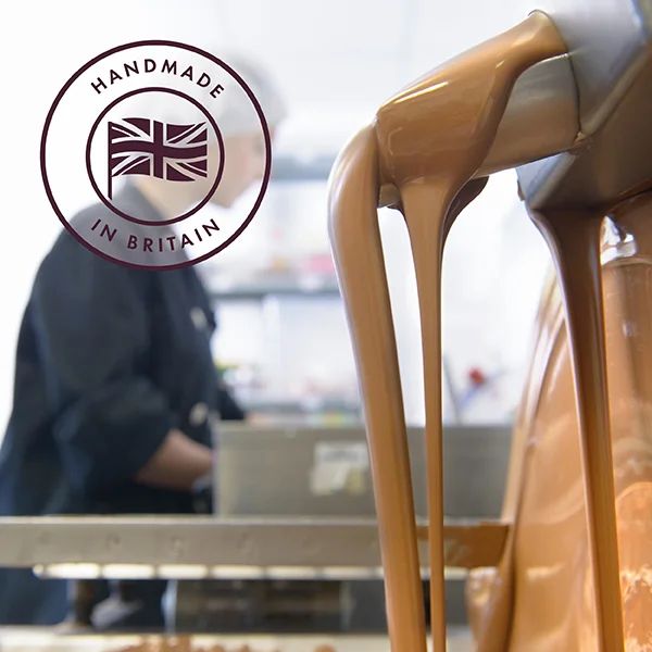 We handmake all of our chocolate in Britiain. Picture shows a member of the team handmaking chocolate