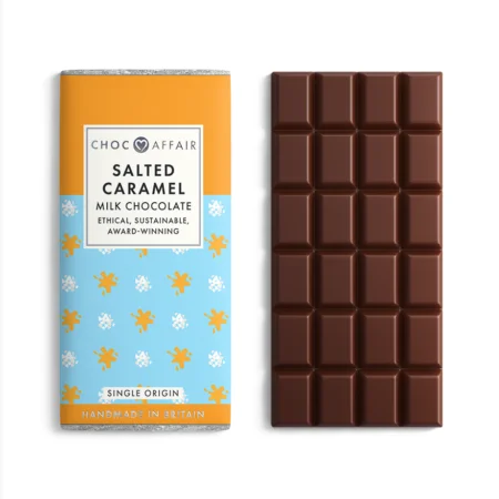 Salted caramel milk chocolate bar next to an unwrapped milk chocolate bar on a white background