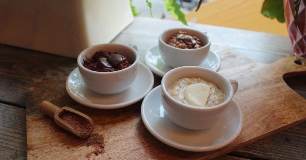 3 mugs of porridge topped with chocolate