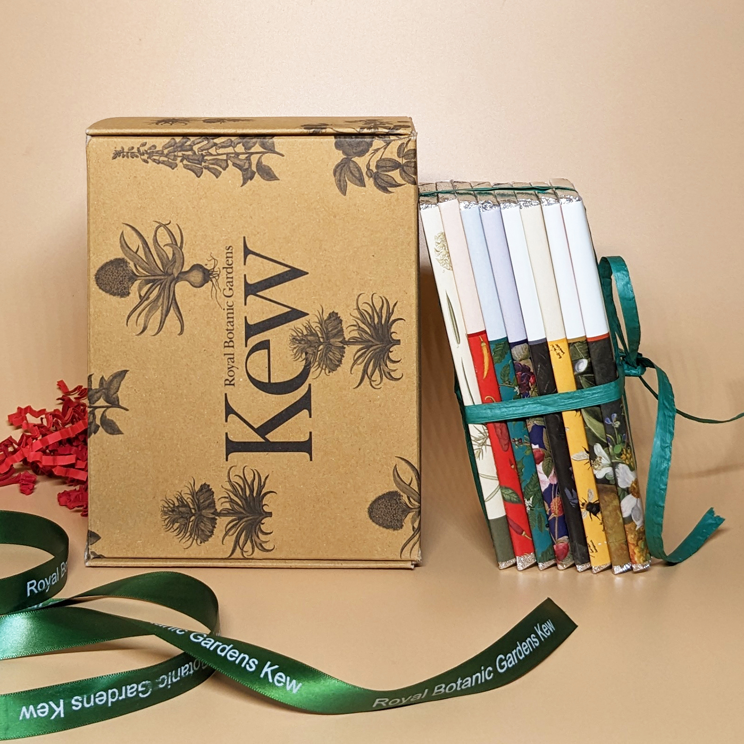 Kew Garden chocolates tied with a ribbon and presented next to a branded box.